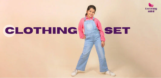 Girl wearing light blue denim dungarees and a pink sweatshirt, kids fashion outfit