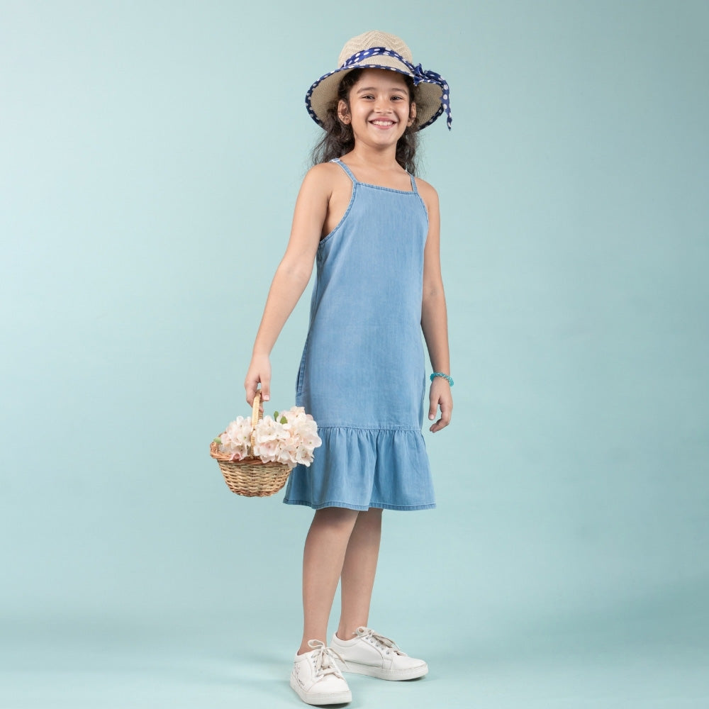 Girl in blue denim dress with straw hat and basket of flowers, kids casual fashion