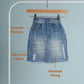 Blue denim skirt on a hanger with text highlighting features against a light blue background