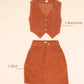 Rust waistcoat and skirt set on a beige background with text indicating contents.