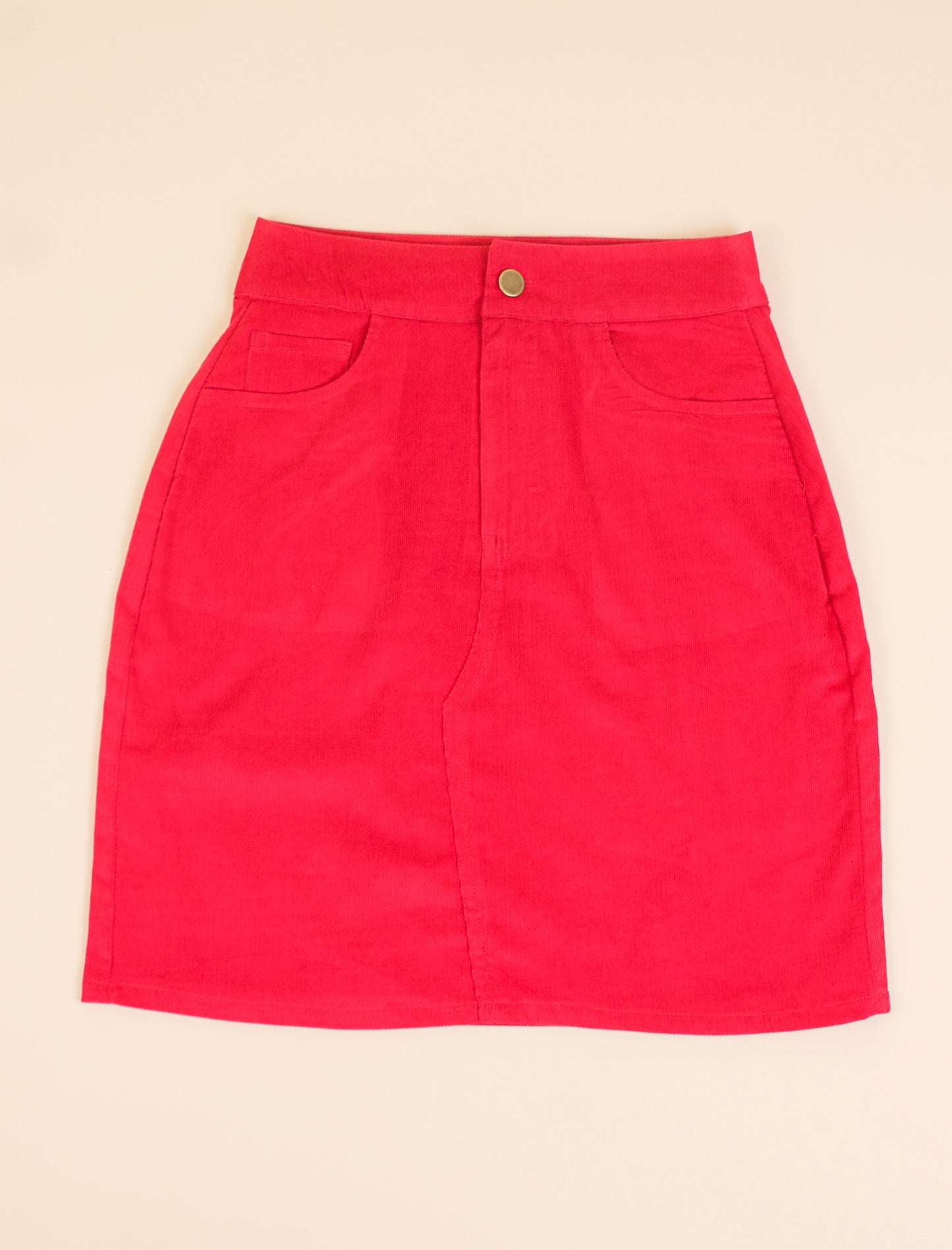 Red skirt on a beige background