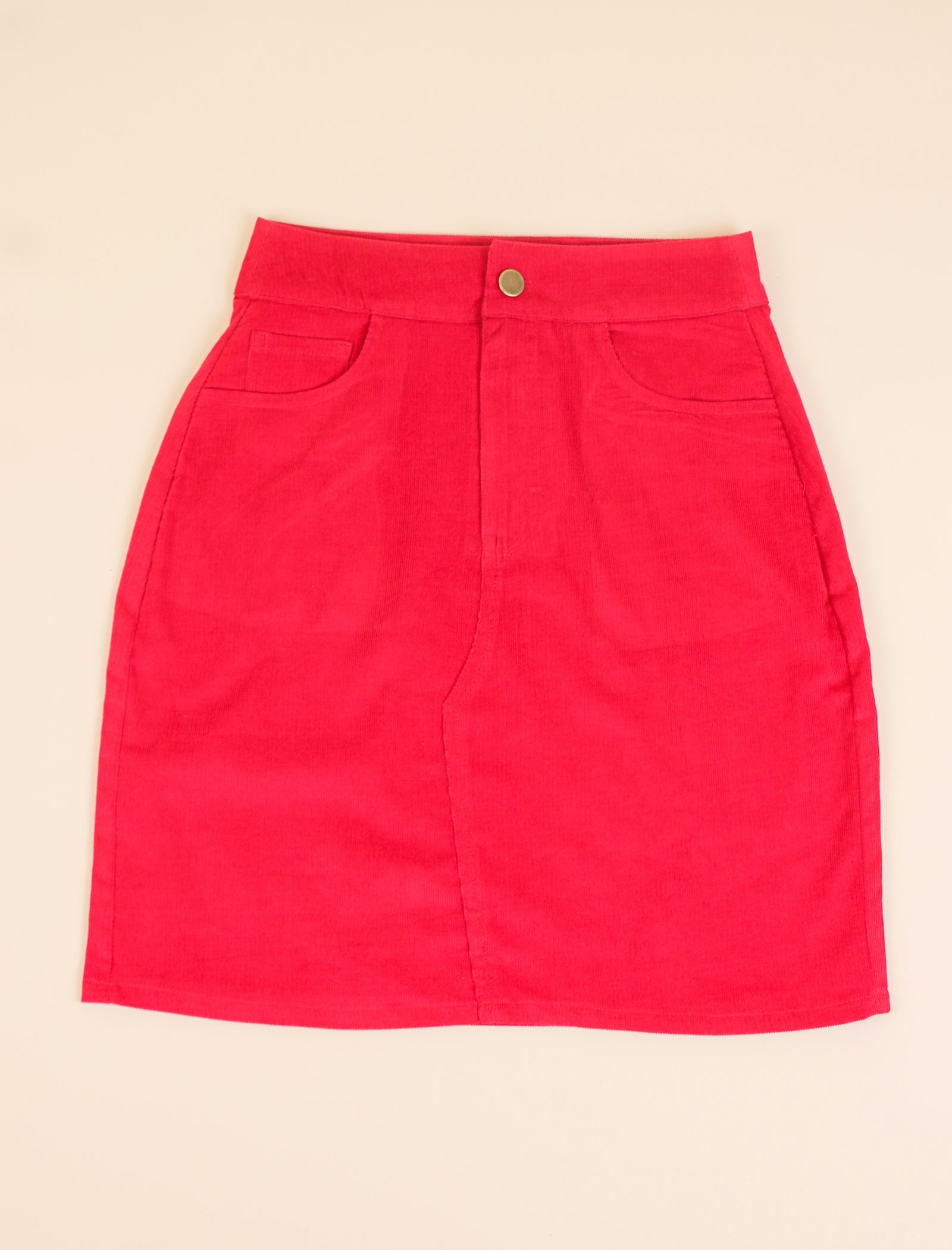 Red skirt on a beige background