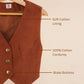 Brown vest on a hanger with text labels indicating features like soft cotton lining, 100% cotton corduroy, and brass buttons.