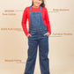 Girl wearing blue denim overalls with text highlighting features on a beige background