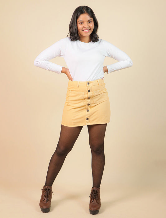Girls wearing a white long-sleeve top and beige skirt on a beige background
