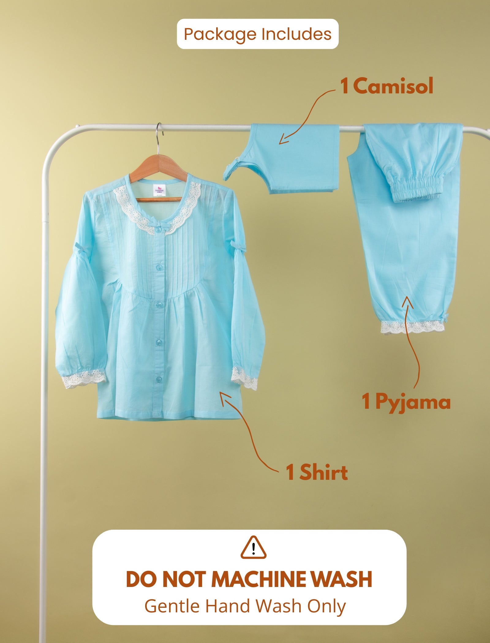 Set of light blue clothing items including a camisol, shirt, and pyjama on a rack with text indicating package contents and washing instructions.