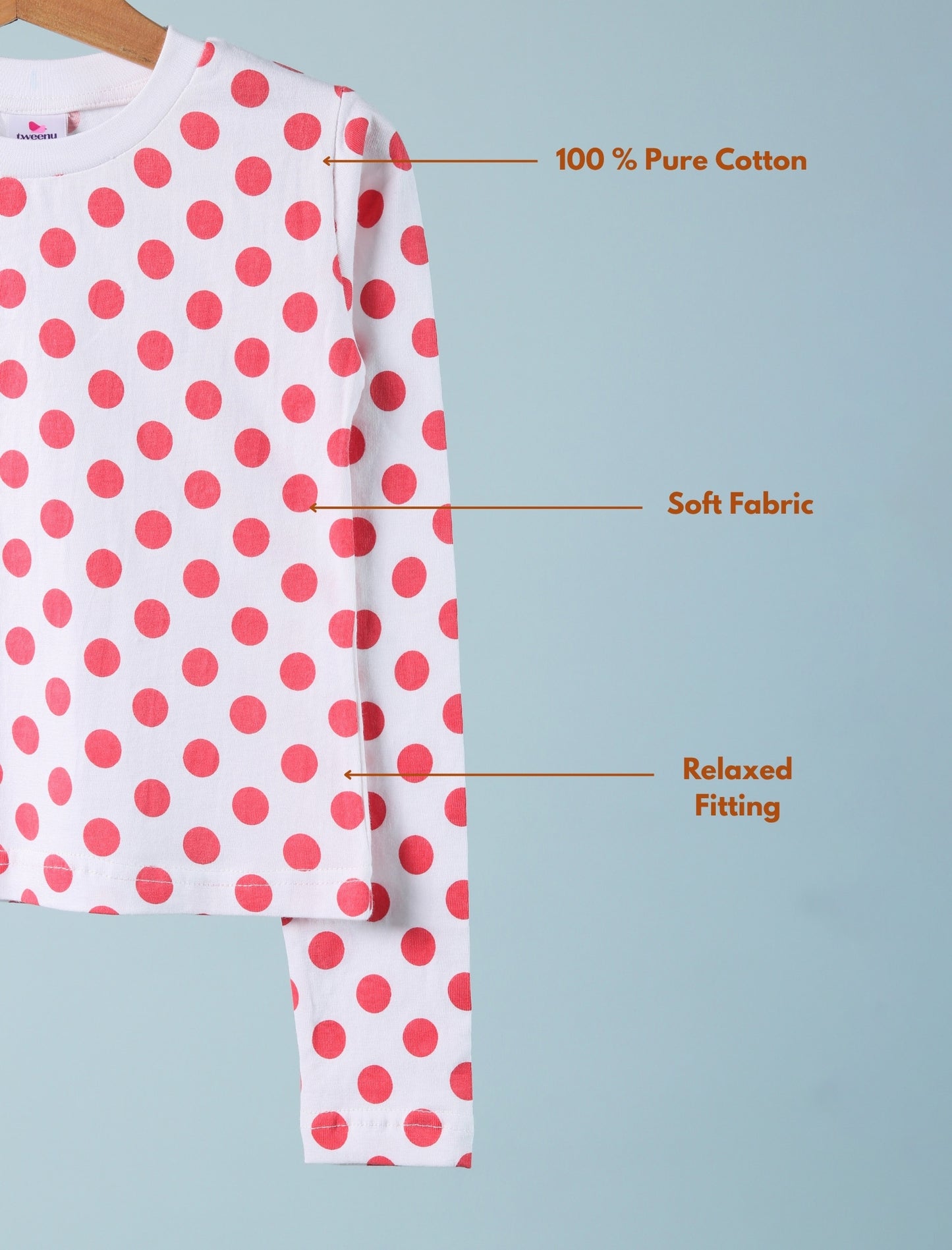 Polka dot shirt with text highlighting features on a light blue background