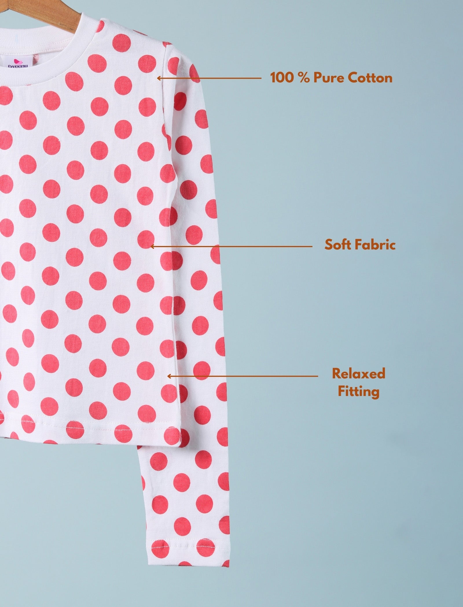 Polka dot shirt with text highlighting features on a light blue background
