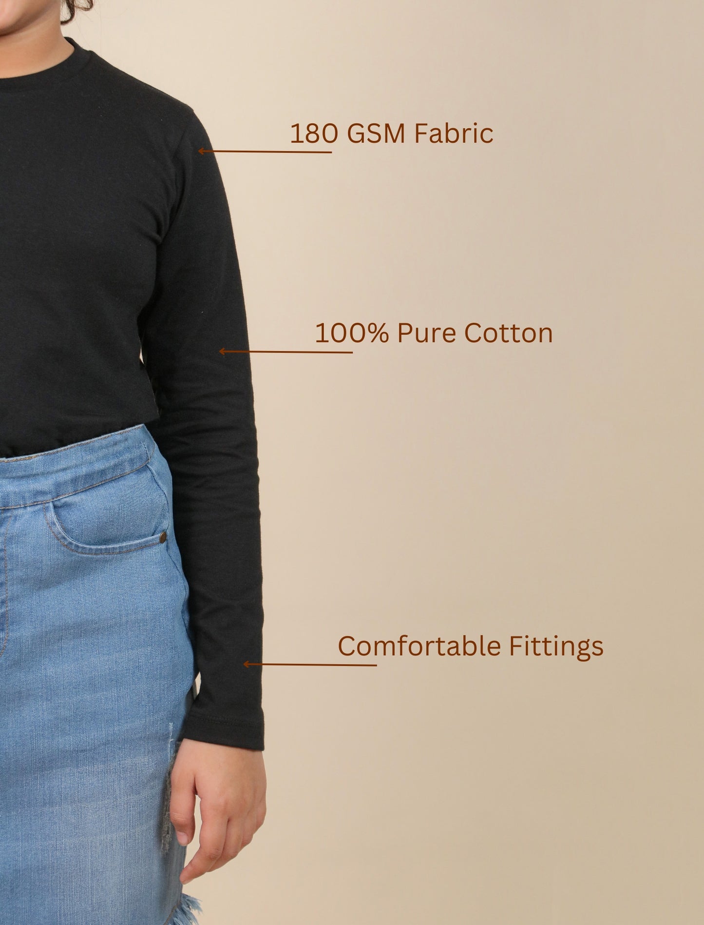 Girls wearing a black long-sleeve shirt and blue jeans with text on fabric quality and comfort.