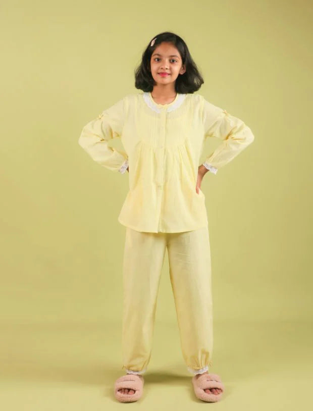 Girl wearing pastel yellow cotton nightsuit with lace trim, Tweeny Mini