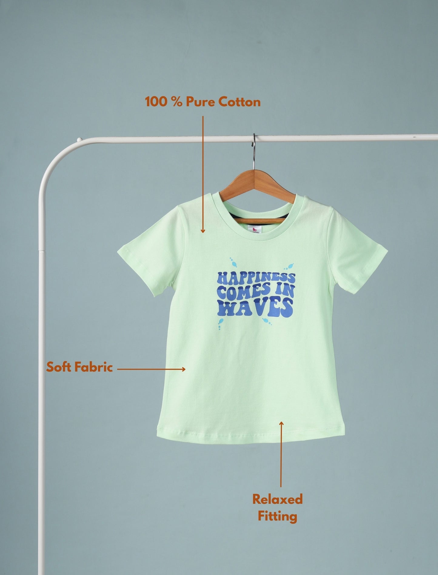 Light green t-shirt with text on a hanger against a gray background