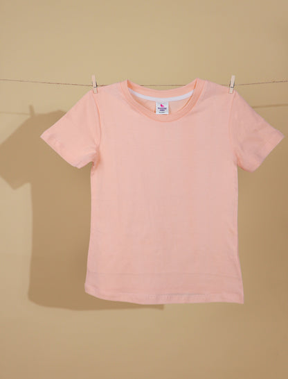 Peach t-shirt on a beige background