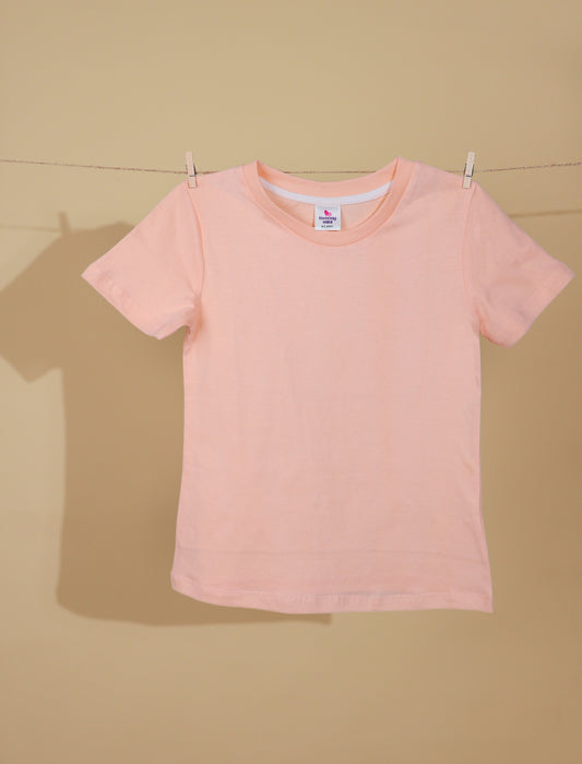 Peach t-shirt on a beige background