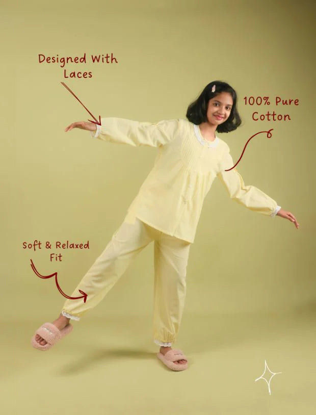 Girl wearing pastel yellow cotton nightsuit with lace trim, Tweeny Mini