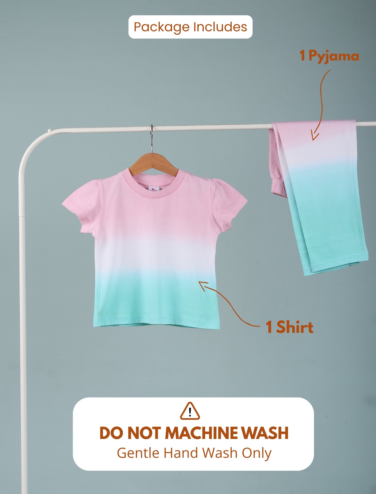 Gradient shirt and pyjama set on a hanger with washing instructions.