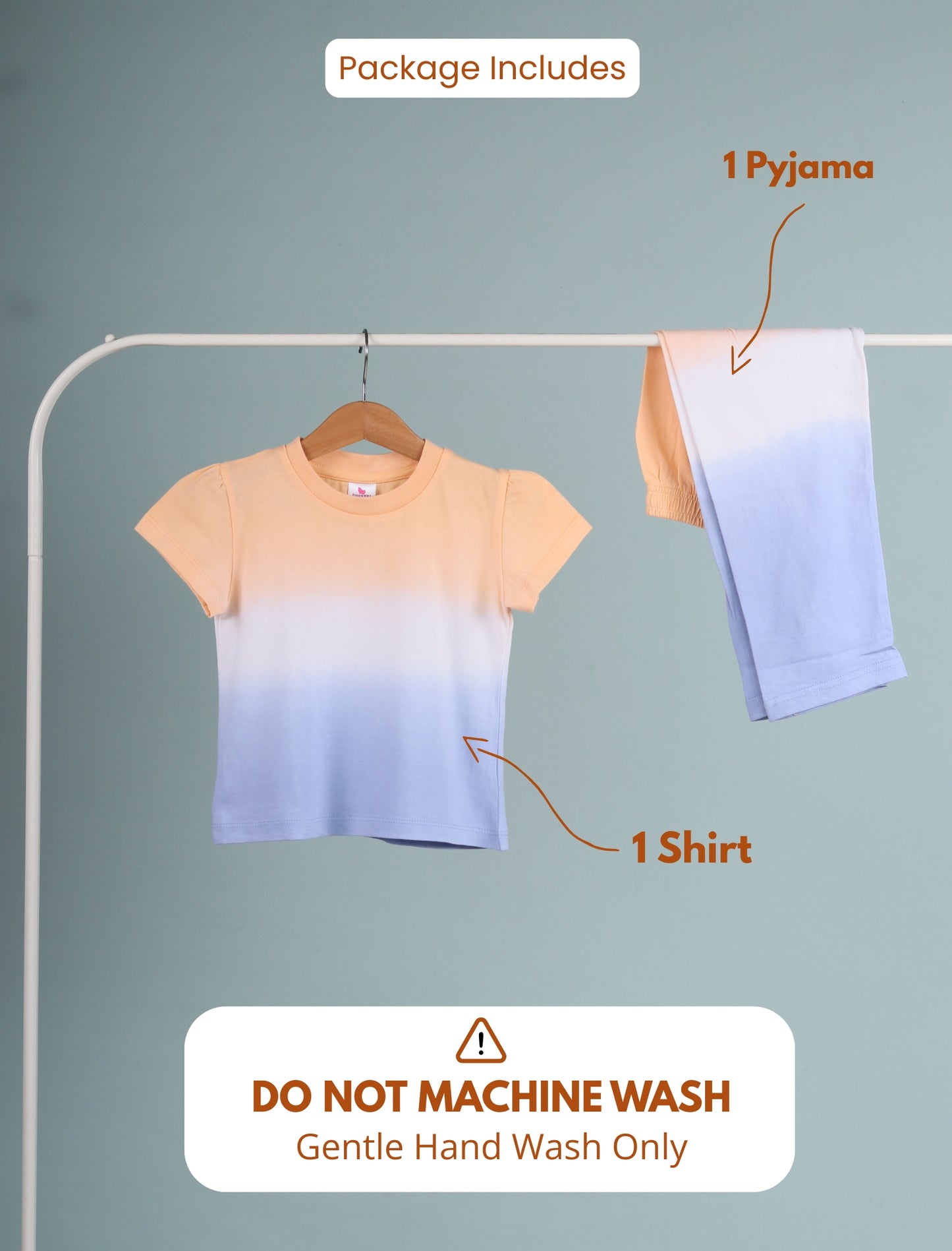 Set of shirt and pajama on a hanger with washing instructions.