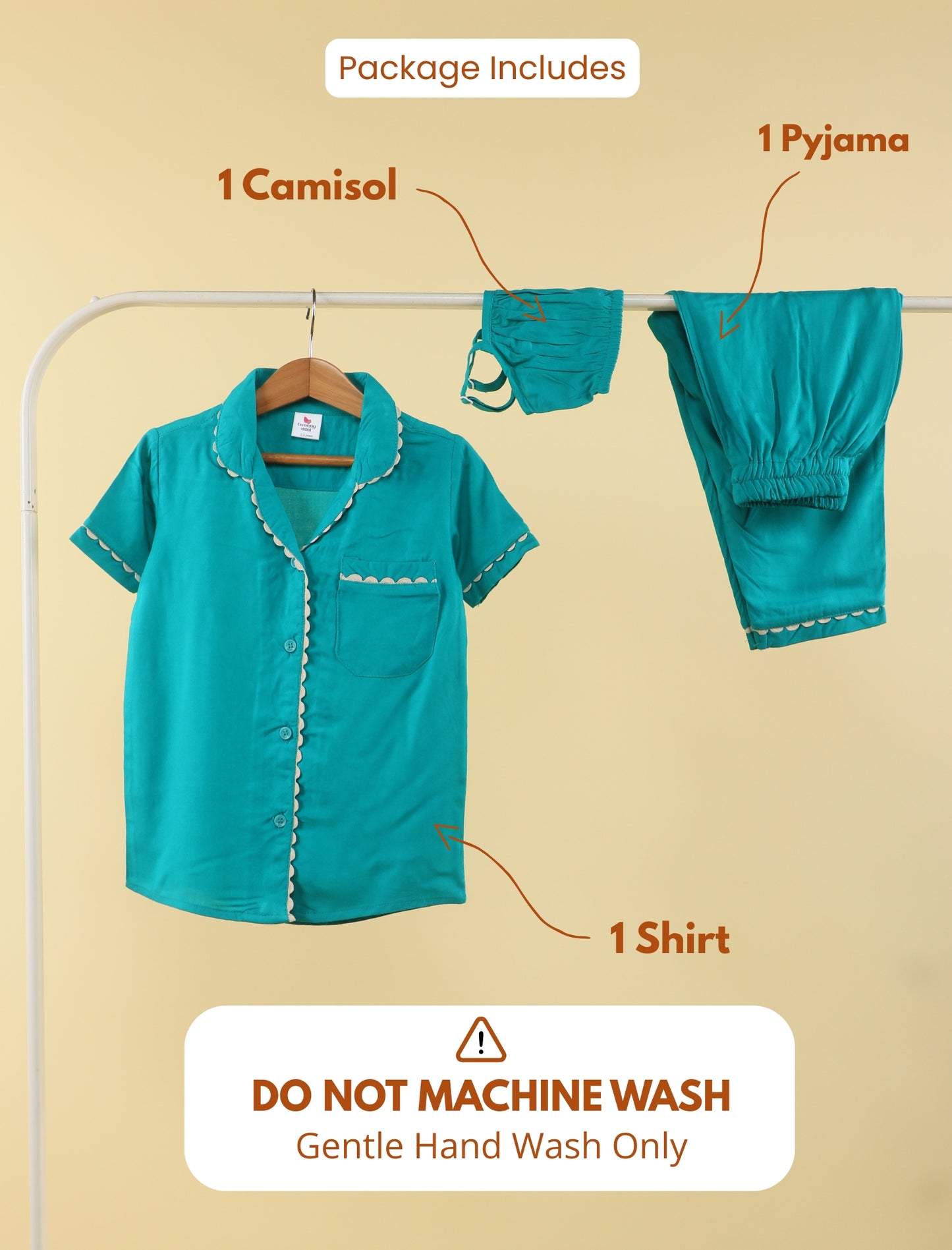 Teal outfit with shirt, camisole, and pyjama on a rack against a beige background.