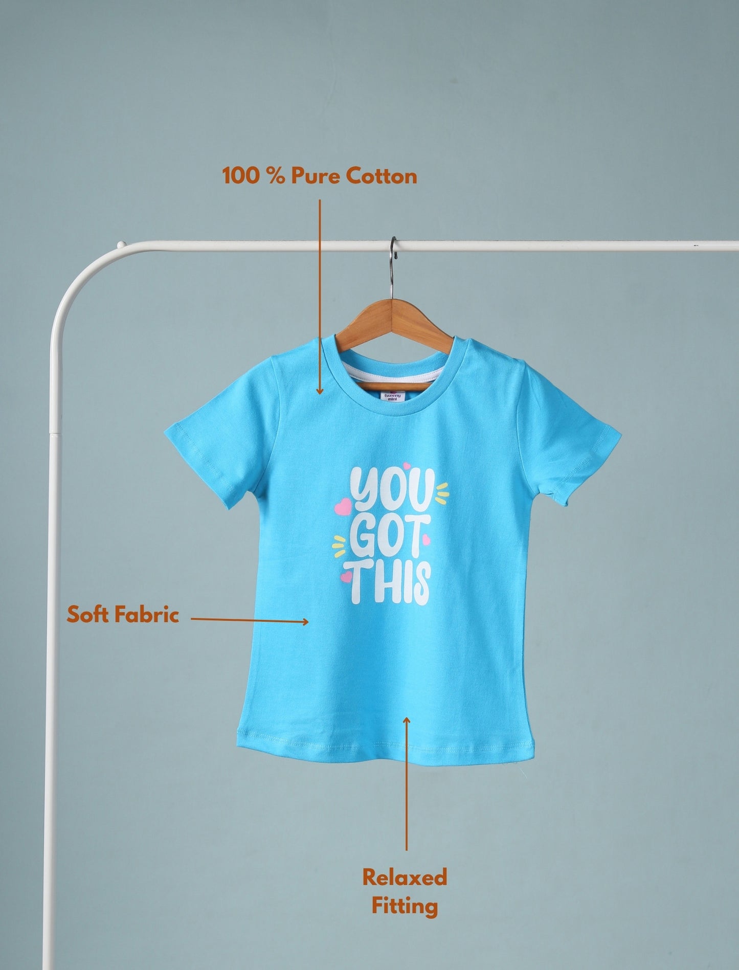 Blue t-shirt with 'You Got This' text on a hanger against a gray background