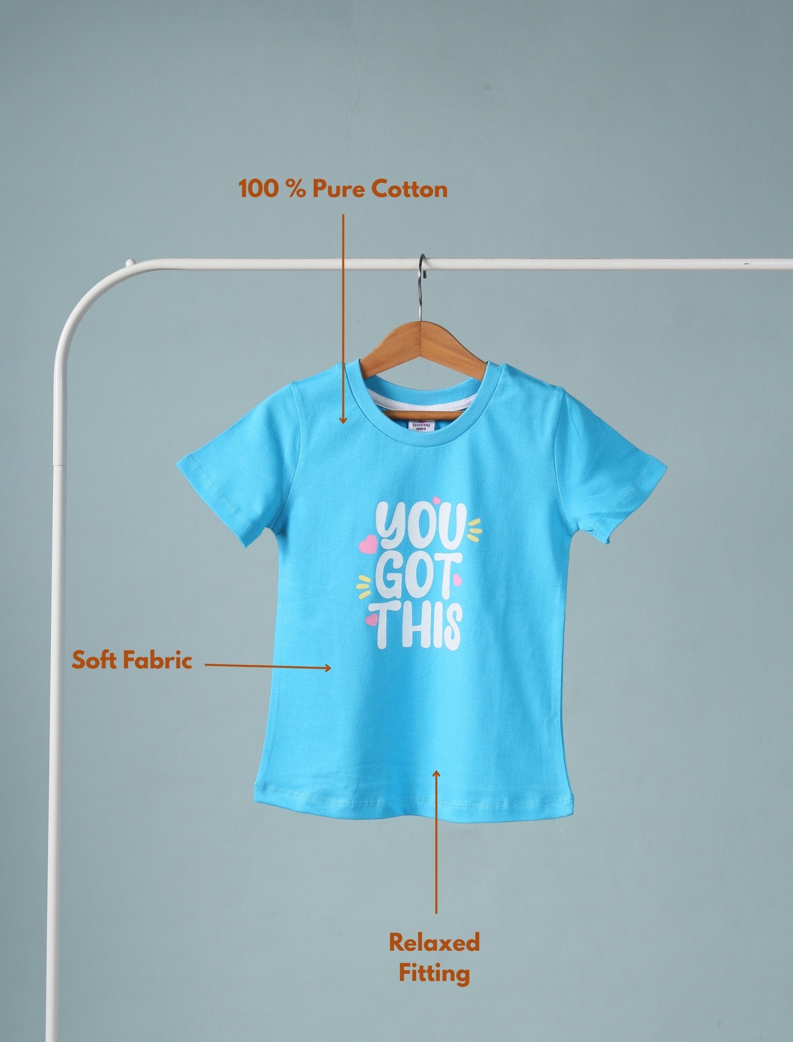 Blue t-shirt with 'You Got This' text on a hanger against a gray background