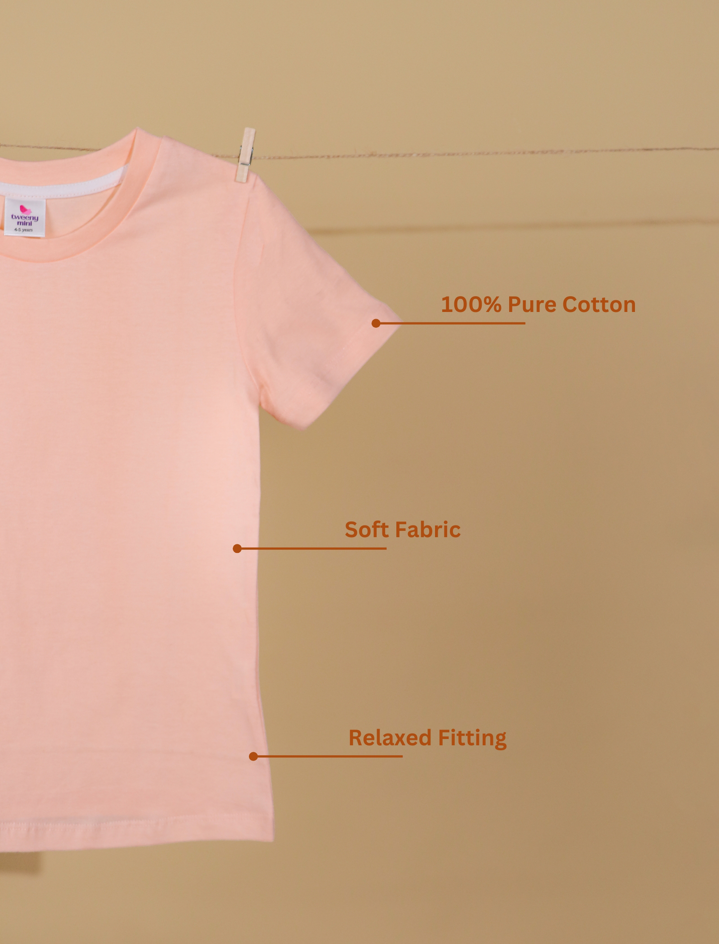 Peach t-shirt on a beige background with text highlighting features.