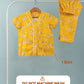Yellow floral shirt and pajama set on a hanger with washing instructions.