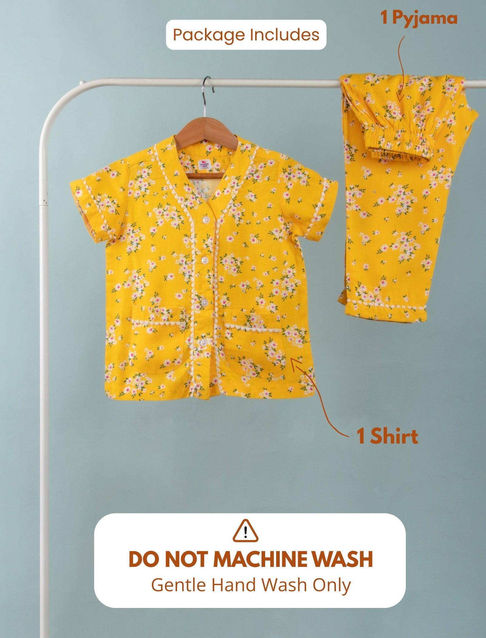 Yellow floral shirt and pajama set on a hanger with washing instructions.