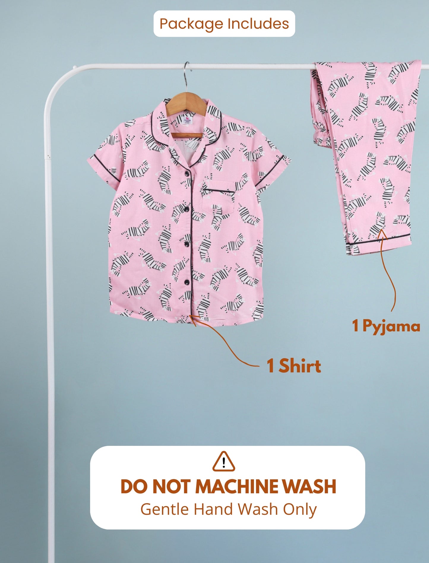 Pink pajama set with shirt and pants on a hanger against a light blue background.