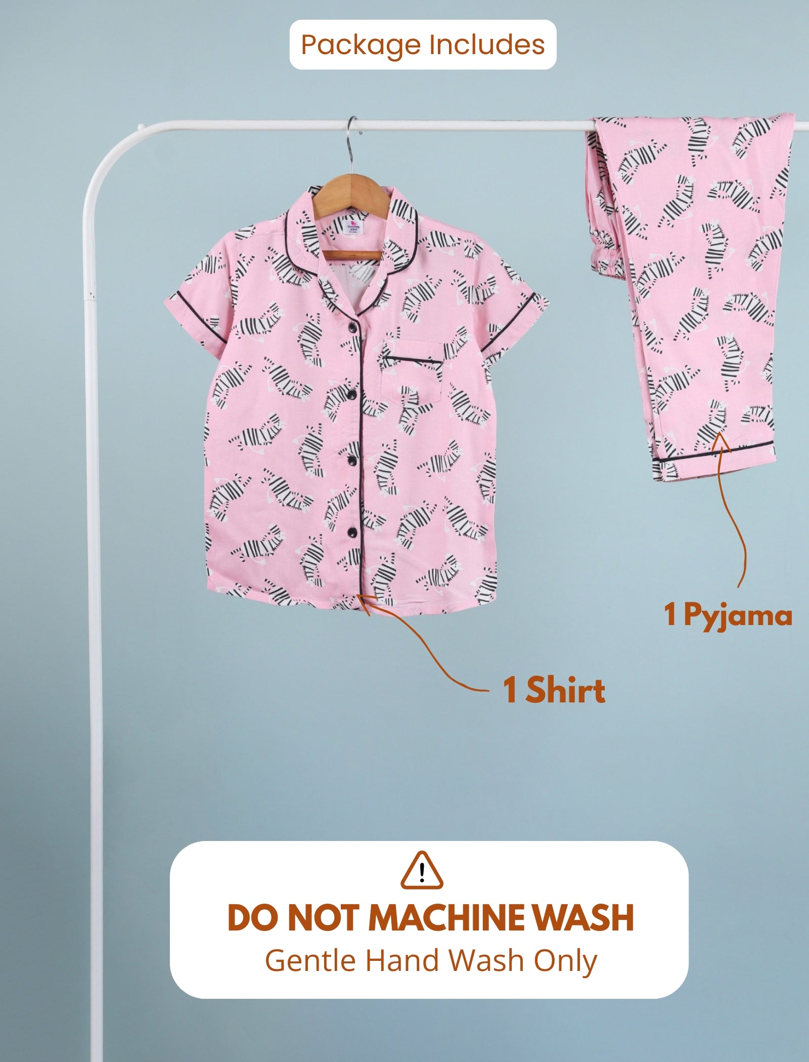Pink pajama set with shirt and pants on a hanger against a light blue background.