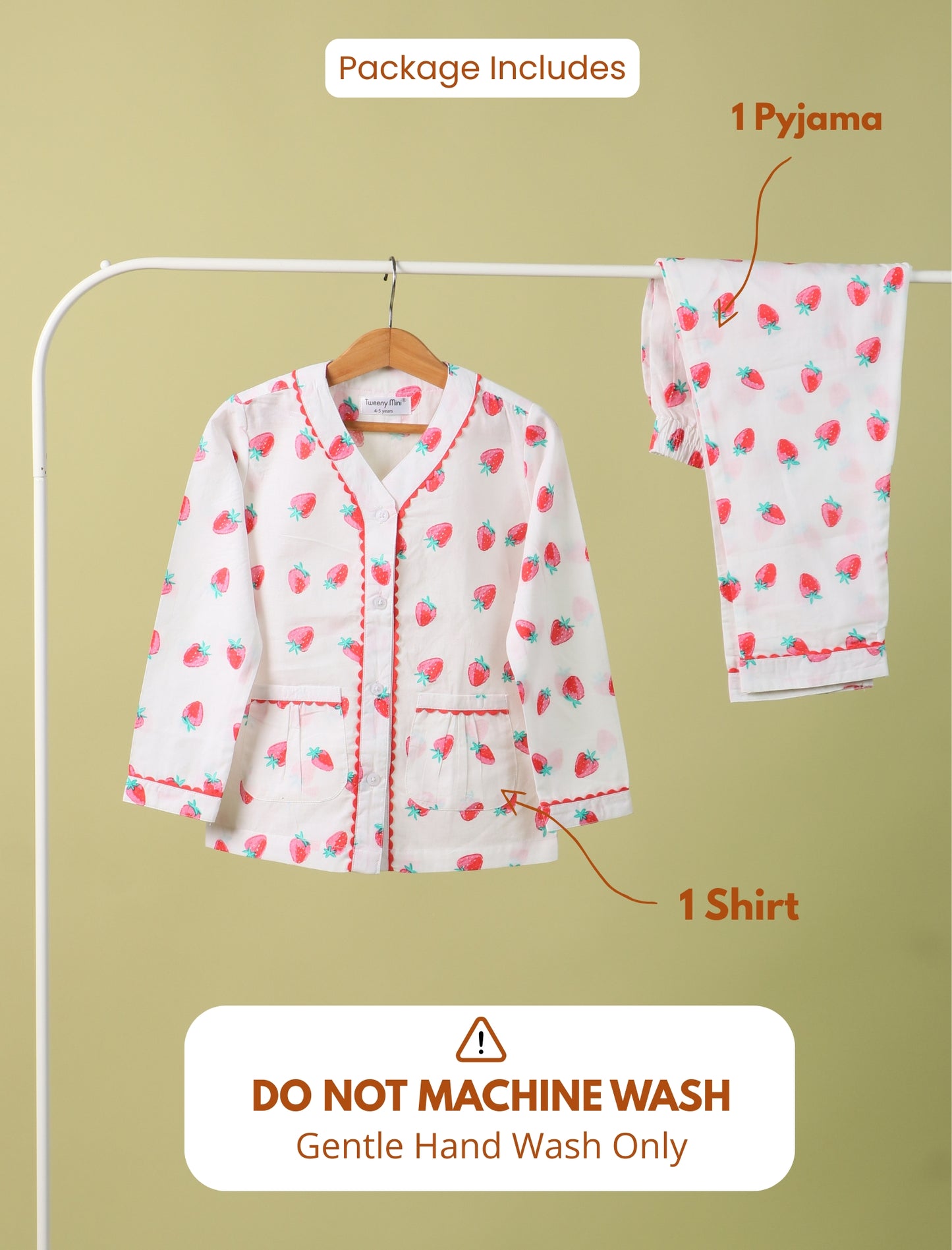 Girls kids pyjama set with shirt and pants on a hanger against a beige background.