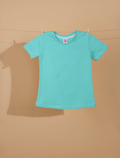 Turquoise t-shirt on a beige background
