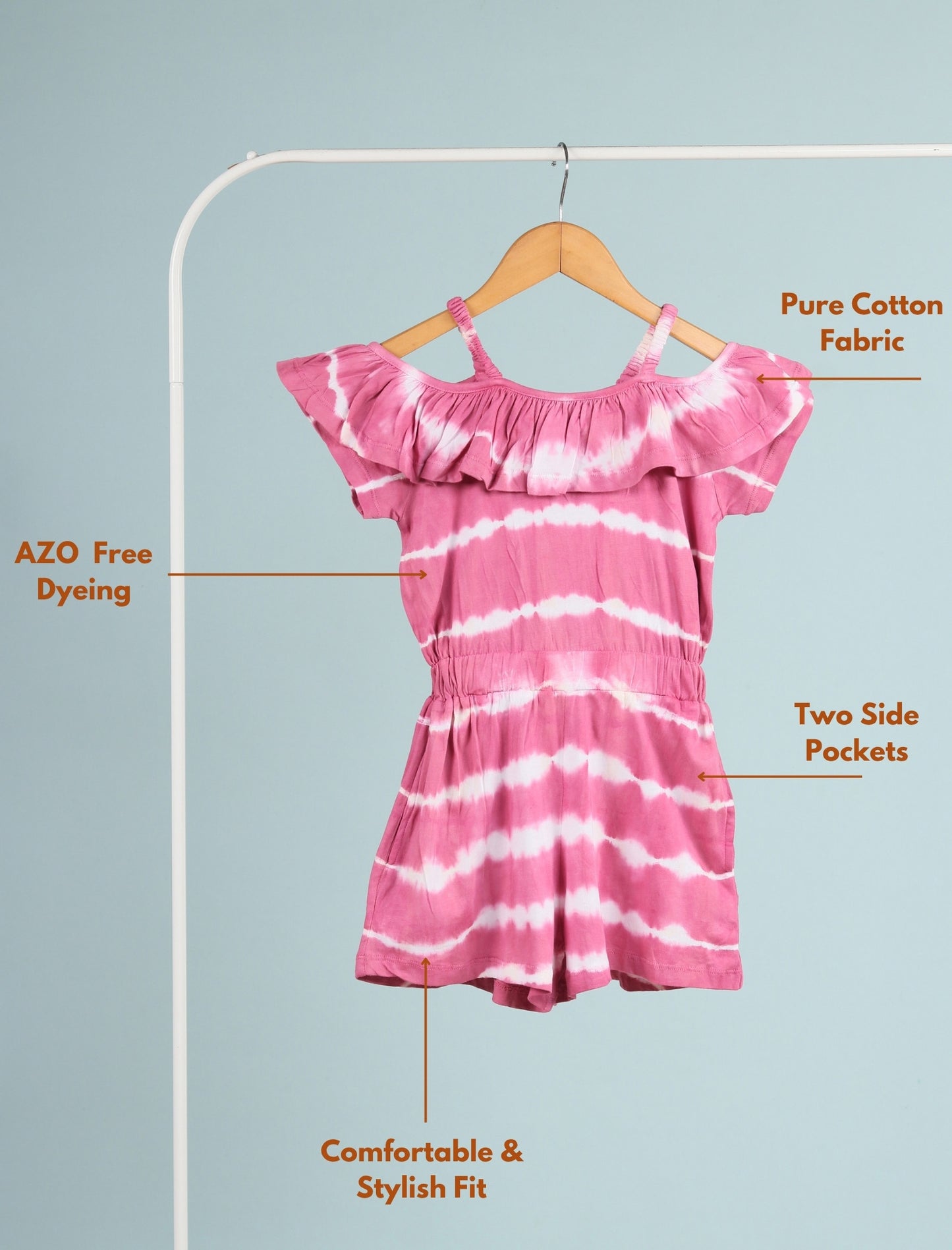 Pink and white tie-dye dress on a hanger with text highlighting features.