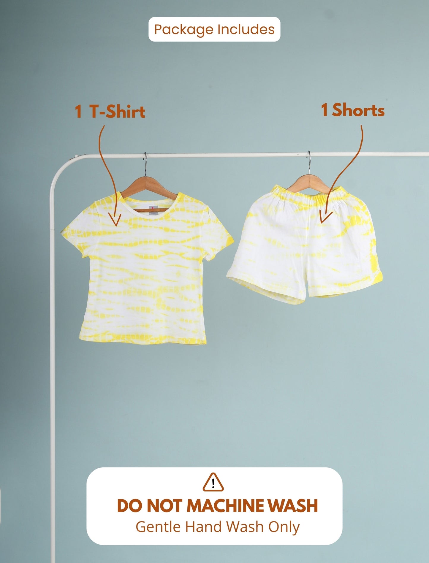 T-shirt and shorts on hangers with text indicating package contents and washing instructions.