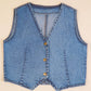 Blue denim vest on a beige background