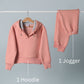Coral Peach hoodie sweatshirt and jogger set on a gray background with labels.