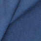 Close-up of blue 100% cotton corduroy fabric with text overlay.
