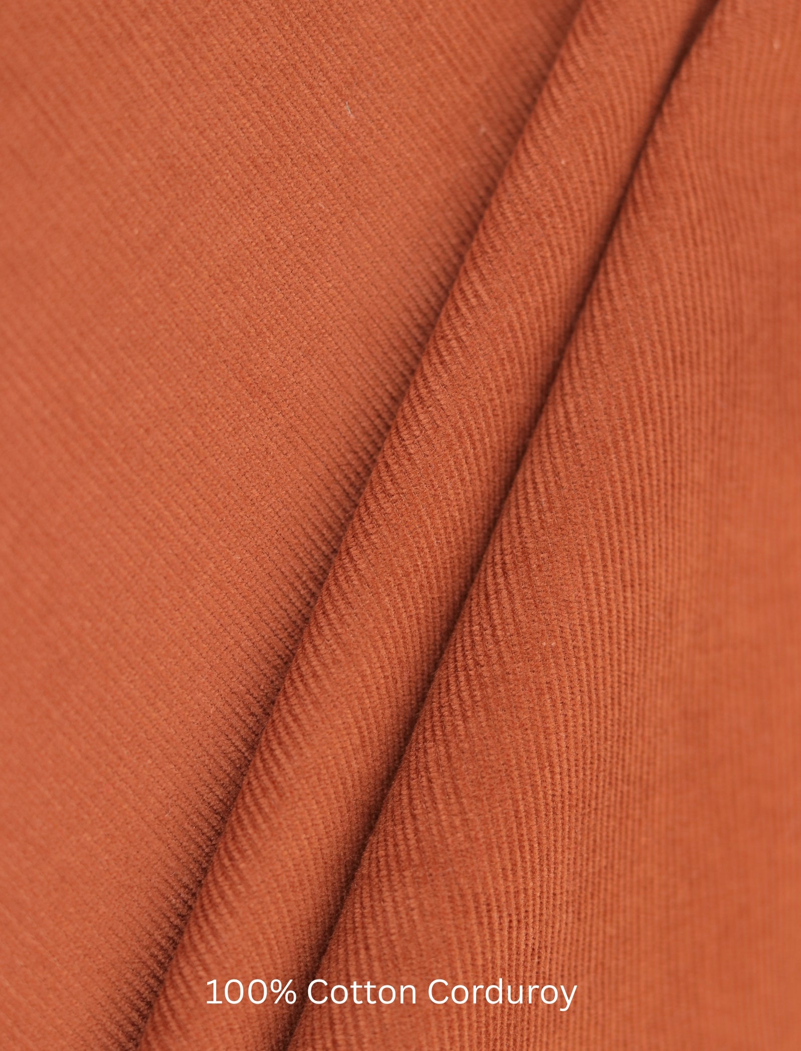 Close-up of brown corduroy fabric with '100% Cotton Corduroy' text.