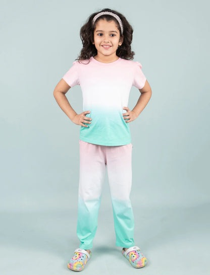 Girl in pastel tie-dye night suit with ombré pink, white, and mint green shades