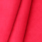 Close-up of red cotton corduroy fabric with '100% Cotton Corduroy' text.